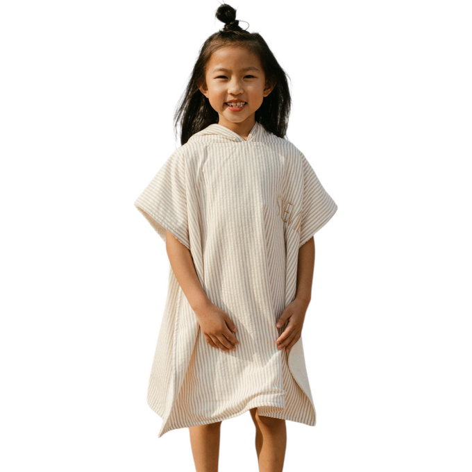 Children wearing Delicious Monsters ponchos